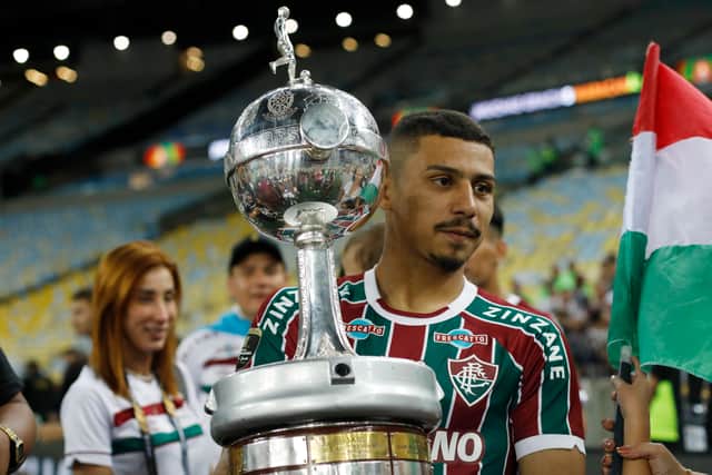 Andre of Fluminense  holds the trophy as the team becomes champions after winning the final match of Copa CONMEBOL Libertadores 2023 between Fluminense and Boca Juniors at Maracana Stadium on November 04, 2023 in Rio de Janeiro, Brazil. (Photo by Ricardo Moreira/Getty Images)
