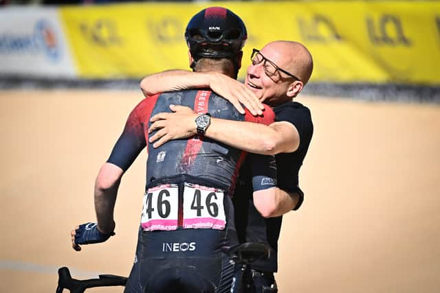 Brailsford embraces Ineos Grenadiers rider Dylan van Baarle after the Dutchman won the famous Paris-Roubaix race in 2022.