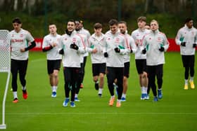 Manchester United players, including Mason Mount. The Red Devils face Wigan Athletic in the FA Cup on Monday evening. 