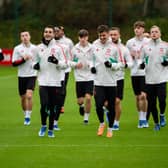 Manchester United players, including Mason Mount. The Red Devils face Wigan Athletic in the FA Cup on Monday evening. 