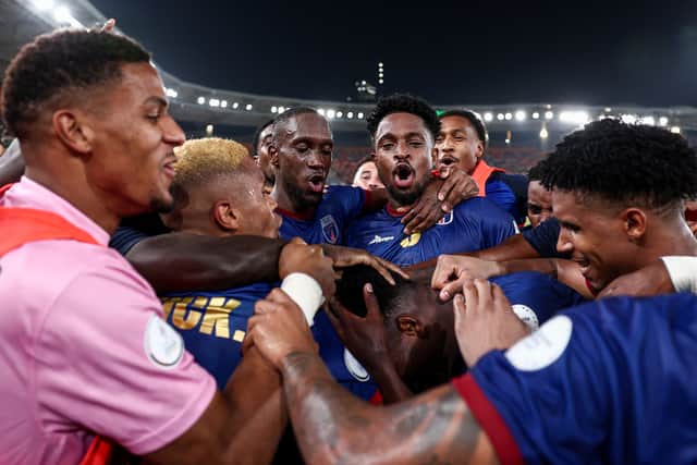 Cape Verde's players celebrate after their late equaliser against Egypt sealed their place in the last 16.