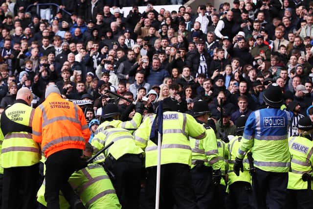 Police, stewards and fans clash at the Hawthorns.