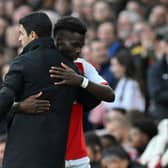 Arsenal manager Mikel Arteta and winger Bukayo Saka. The Gunners could reportedly demand as much as £200m for the sale of their academy graduate.