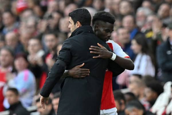 Arsenal manager Mikel Arteta and winger Bukayo Saka. The Gunners could reportedly demand as much as £200m for the sale of their academy graduate.