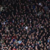 Aston Villa fans watch on at Villa Park.