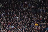 Aston Villa fans watch on at Villa Park.