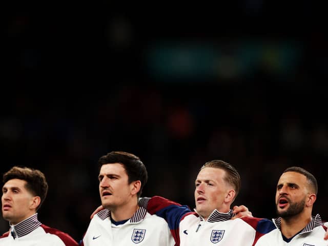 England players John Stones, Harry Maguire, Jordan Pickford, and Kyle Walker