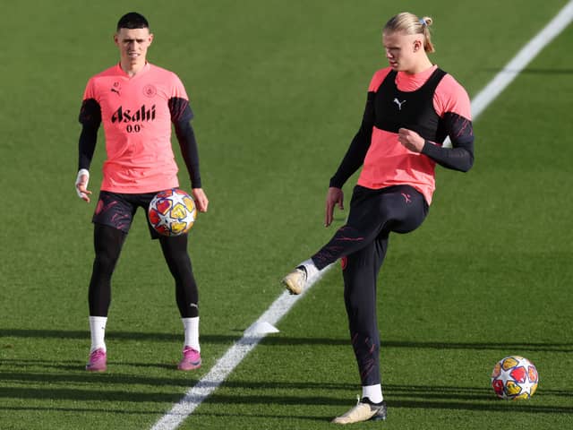 Man City players Erling Haaland and Phil Foden.