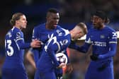 Cole Palmer and Nicolas Jackson of Chelsea clash ahead of a penalty kick, as Conor Gallagher and Noni Madueke react