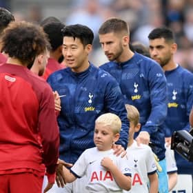 Liverpool and Tottenham players shake hands prior to a Premier League fixture.