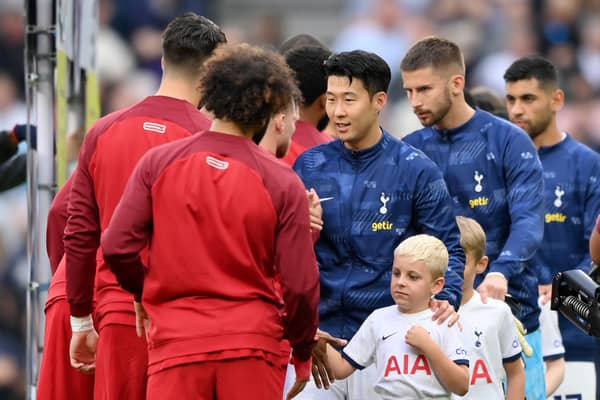 Liverpool and Tottenham players shake hands prior to a Premier League fixture.