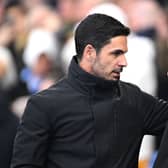 Mikel Arteta, Manager of Arsenal, interacts with Roberto De Zerbi, Manager of Brighton & Hove Albion