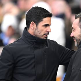 Mikel Arteta, Manager of Arsenal, interacts with Roberto De Zerbi, Manager of Brighton & Hove Albion