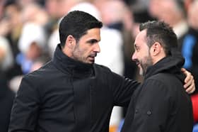 Mikel Arteta, Manager of Arsenal, interacts with Roberto De Zerbi, Manager of Brighton & Hove Albion