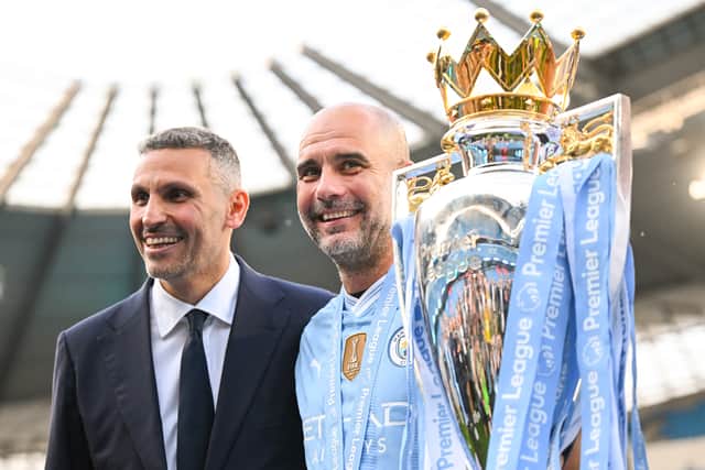 Manchester City chairman Khaldoon Al Mubarak and head coach Pep Guardiola pose with the Premier League trophy their team successfully defended in the 2023/24 season.