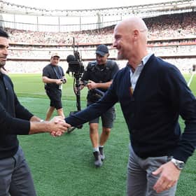 Mikel Arteta, Manager of Arsenal, shakes hands with Erik ten Hag, Manager of Manchester United
