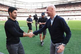 Mikel Arteta, Manager of Arsenal, shakes hands with Erik ten Hag, Manager of Manchester United