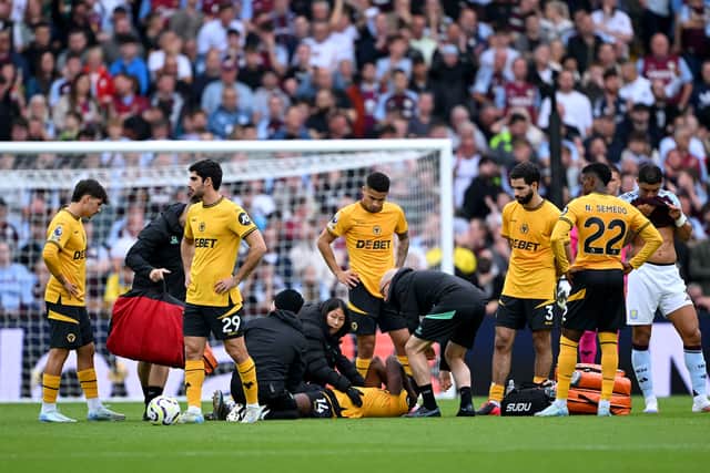 Yerson Mosquera was stretchered off in Wolves' 3-1 defeat to Aston Villa at the weekend. (Image: Getty Images)