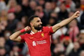 Mohamed Salah of Liverpool celebrates scoring his team's second goal during the UEFA Champions League 2024/25 League Phase MD2 match between Liverpool FC and Bologna FC 1909 at Anfield on October 02, 2024 in Liverpool, England. (Photo by Carl Recine/Getty Images)