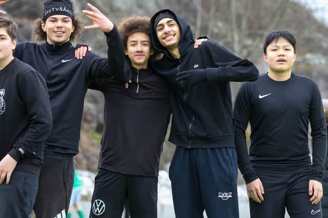 JFF players unwind on the touchline during a game against Sundbybergs IK.