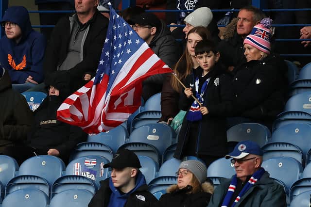 A young Rangers fan waves the stars and stripes during the game against St. Mirren.