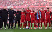 Vitezslav Jaros, Arne Slot, Manger of Liverpool, Sipke Hulshoff, assistant Manager of Liverpool, Andrew Robertson, Virgil van Dijk, Mohamed Salah, Alexis Mac Allister, Darwin Nunez and Luis Diaz celebrate with the fans after confirmation of winning the Premier League title in the Premier League match between Liverpool FC and Tottenham Hotspur FC at Anfield on April 27, 2025 in Liverpool, England. (Photo by Carl Recine/Getty Images)