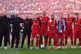 Vitezslav Jaros, Arne Slot, Manger of Liverpool, Sipke Hulshoff, assistant Manager of Liverpool, Andrew Robertson, Virgil van Dijk, Mohamed Salah, Alexis Mac Allister, Darwin Nunez and Luis Diaz celebrate with the fans after confirmation of winning the Premier League title in the Premier League match between Liverpool FC and Tottenham Hotspur FC at Anfield on April 27, 2025 in Liverpool, England. (Photo by Carl Recine/Getty Images)