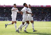 Morgan Rogers celebrates with Ollie Watkins and Jacob Ramsey | Getty Images