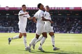 Morgan Rogers celebrates with Ollie Watkins and Jacob Ramsey | Getty Images