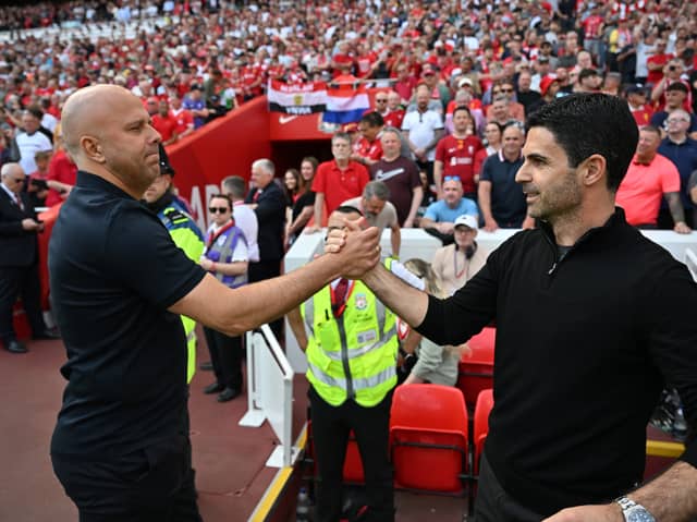 A moment of respect between Arne Slot and Mikel Arteta before the Premier League match between Liverpool and Arsenal | Getty Images