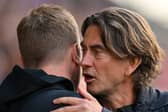 Newcastle United's English head coach Eddie Howe (L) greets Brentford's Danish head coach Thomas Frank ahead of the English Premier League football match between Brentford and Newcastle United at Gtech Community Stadium in London on April 8, 2023. (Photo by Glyn KIRK / AFP) / RESTRICTED TO EDITORIAL USE. /  (Photo by GLYN KIRK/AFP via Getty Images)