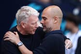 David Moyes and Pep Guardiola embrace before their sides clash in the Premier League | Getty Images