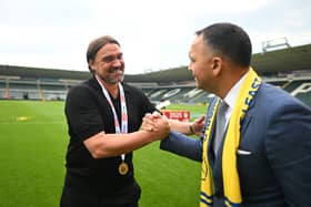 Daniel Farke, Leeds United manager, embraces Paraag Marathe, club chairman and minority shareholder of the 49ers Enterprise.
