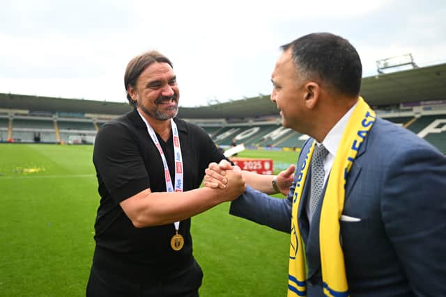 Daniel Farke, Leeds United manager, embraces Paraag Marathe, club chairman and minority shareholder of the 49ers Enterprise.