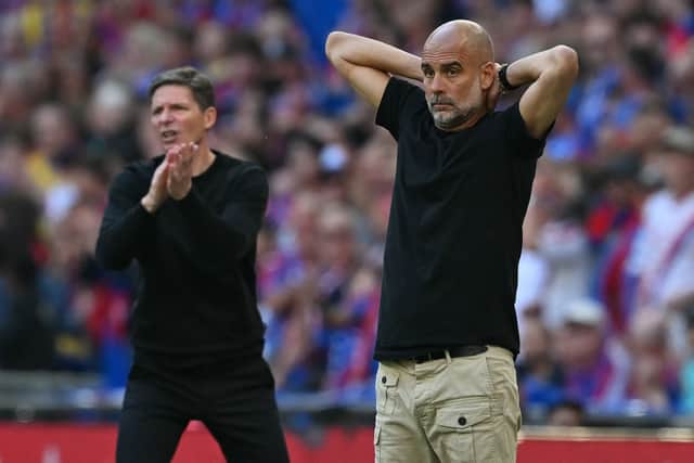 Pep Guardiola (R) and Oliver Glasner during the FA Cup final at Wembley.