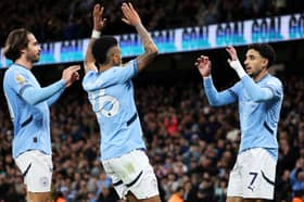 Savinho celebrates with Manchester City teammates Jack Grealish and Omar Marmoush | Michael Steele/Getty Images