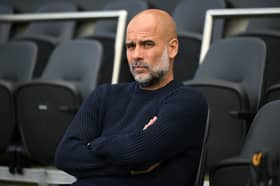 Pep Guardiola looks on ahead of Manchester City's Premier League match with Fulham | Alex Broadway/Getty Images