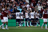 Tottenham Hotspur celebrate scoring against West Ham United in the Premier League.