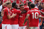 Dan Ndoye celebrates with his Nottingham Forest teammates including Chris Wood, Ola Aina and Morgan Gibbs-White after scoring against Brentford | AFP / Getty Images