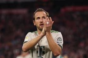 Harry Kane applauds the crowd after a match.