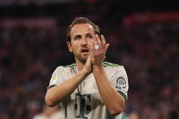 Harry Kane applauds the crowd after a match.