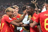 Athletic Club's Nico Williams celebrates with his Spain teammates including Lamine Yamal after scoring against Germany in the UEFA Nations League | Photo by THOMAS KIENZLE/AFP via Getty Images
