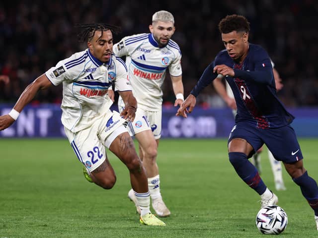 Guela Doue of Strasbourg battles his brother and PSG winger Desire Doue in Ligue 1 |  FRANCK FIFE/AFP via Getty Images