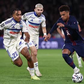 Guela Doue of Strasbourg battles his brother and PSG winger Desire Doue in Ligue 1 |  FRANCK FIFE/AFP via Getty Images