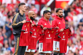 New signings Bryan Mbeumo, Benjamin Sesko, Diego Leon and Matheus Cunha pose for Manchester United at Old Trafford | Molly Darlington/Getty Images