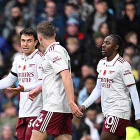 Viktor Gyokeres celebrates with Martin Zubimendi Eberech Eze after his Premier League goal against Burnley | Stuart MacFarlane/Arsenal FC via Getty Images
