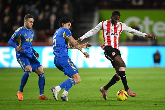 Leeds United defenders Pascal Struijk and Gabriel Gudmundsson battle Brentford's Dango Ouattara for possession in the Premier League | Mike Hewitt/Getty Images