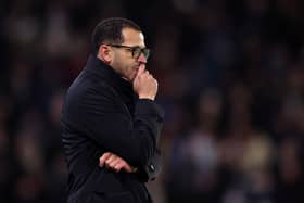 Liam Rosenior strikes a pensive pose on the Chelsea touchline