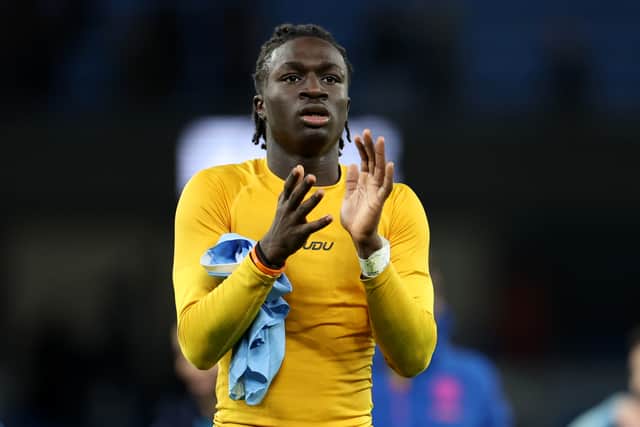 Mateus Mané applauds the Wolves fans after a match against Manchester City