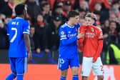 Gianluca Prestianni covers his mouth as he insults Vinícius Júnior